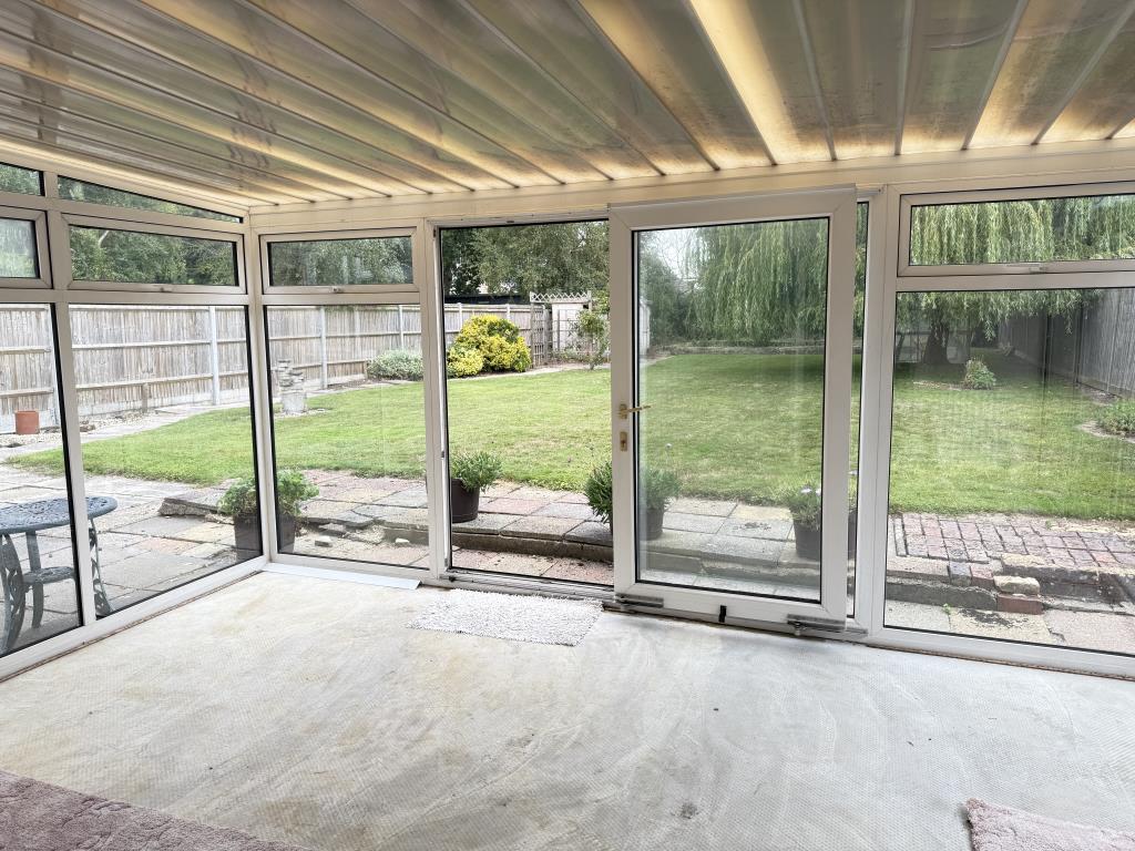Lot: 109 - FOUR-BEDROOM DETACHED BUNGALOW FOR IMPROVEMENT ON 0.21 ACRES - Conservatory with view to garden